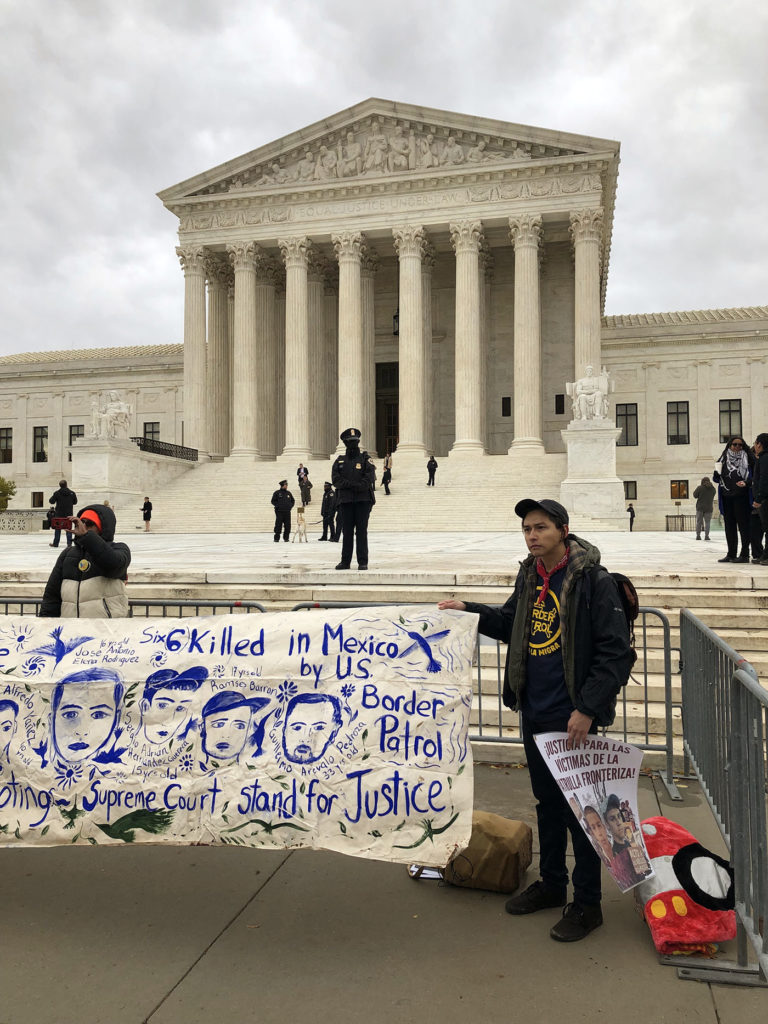 The author protests outside of the Supreme Court