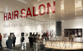 Photo of glass door for the "Hair Salon: Black Hair as Architecture" exhibit