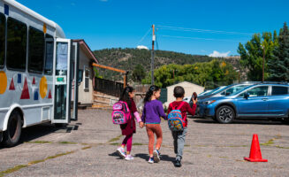 Preschool students walking in a parking lot