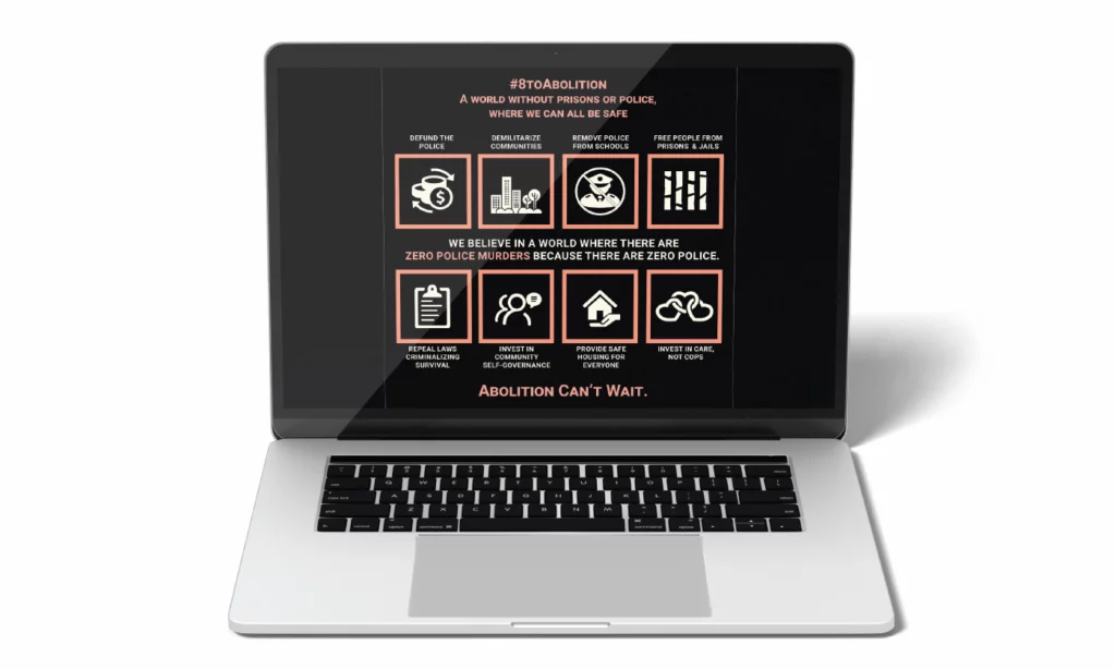 A laptop computer displays the viral social media graphic created by "8 to Abolition" that identifies the steps toward "A world without prisons or police."