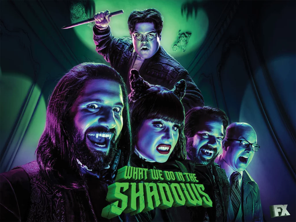 A promotional shot from the FX TV series ”What We Do in the Shadows” shows the four main characters as vampires, with their human familiar hovering above them.