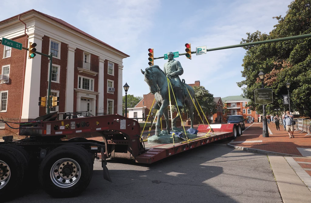 A statue of Confederate Gen. Robert E. Lee is hauled away on a large truck from Market Street Park in Charlottesville, Virginia, on July 10, 2021.