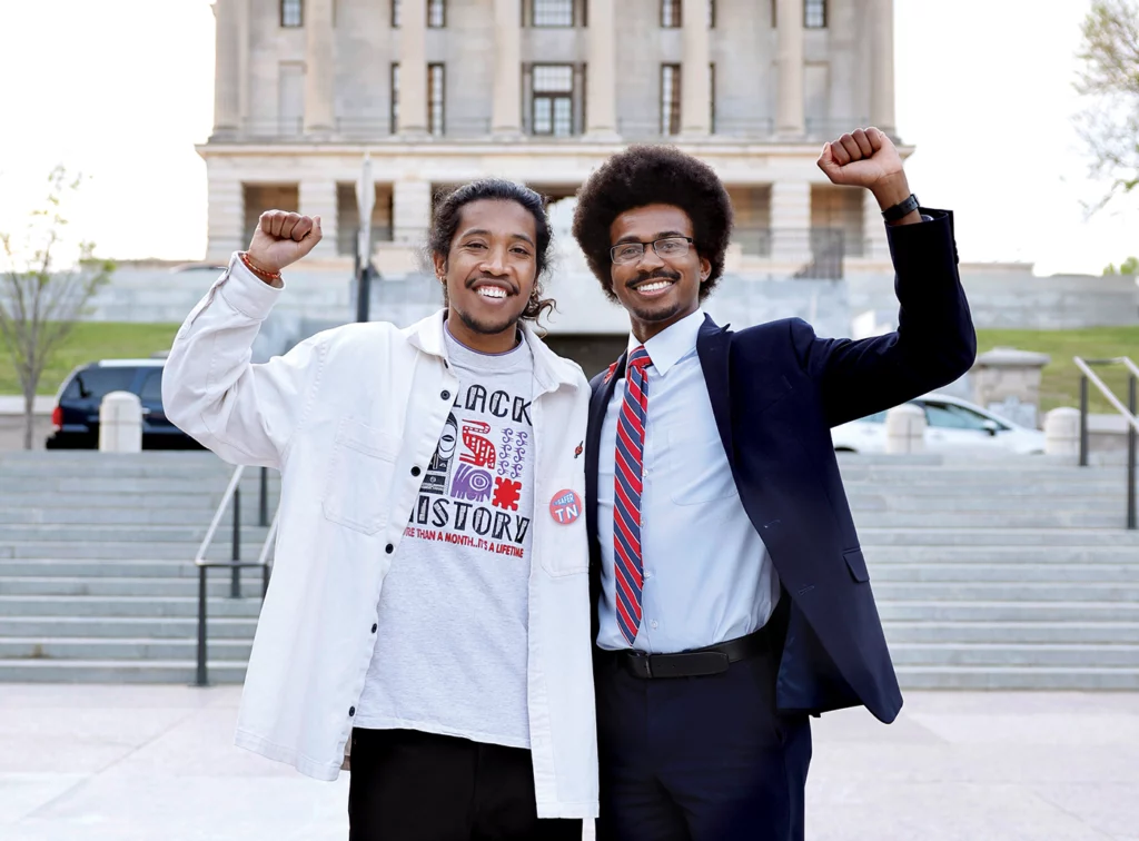 Tennessee State Reps. Justin Jones (left) and Justin J. Pearson raise their fists in support of a demonstration against gun violence outside the state capitol on April 18, 2023.