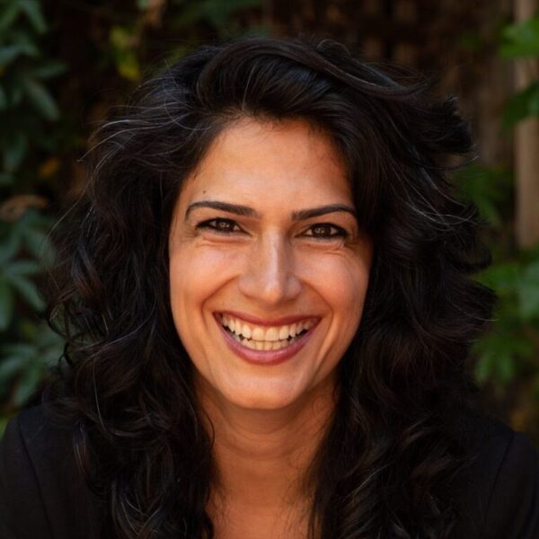 Niloufar Khonsari is a woman with brown skin and long black hair