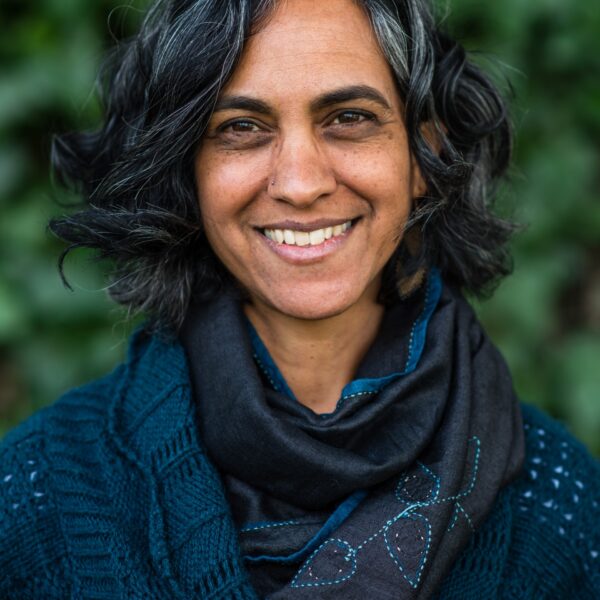 Michelle Mascarenhas, an Indian woman, smiles at the camera
