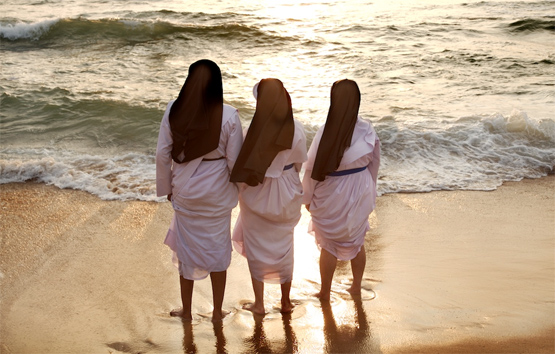 Nuns on beach. Photo by Michael Foley.