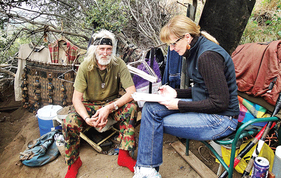 Kerry Morrison interviews homeless veteran John Watkins in the Hollywood Hills. Hollywood was one of the first communities to join the 100