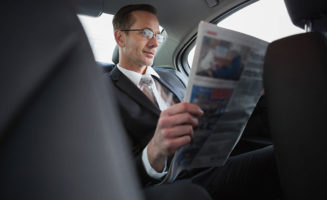 Businessman Reading Newspaper photo from Shutterstock