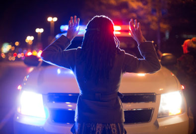 "Hands Up Don't Shoot" with cop car by Joshua Sinn