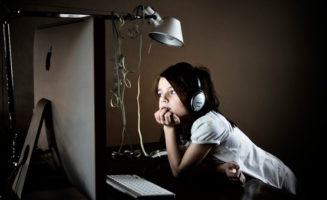 Kid using a computer.