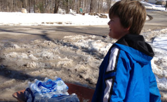 Bryson Spencer delivers water in West Virginia. Photo by Jackson Kusiak.