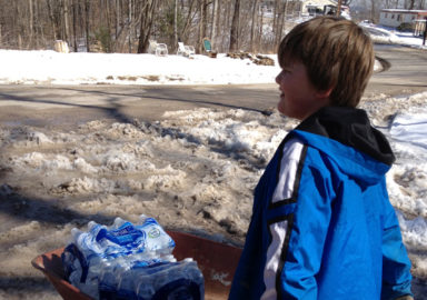 Bryson Spencer delivers water in West Virginia. Photo by Jackson Kusiak.