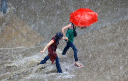 Walking in rain by Portokalis.
