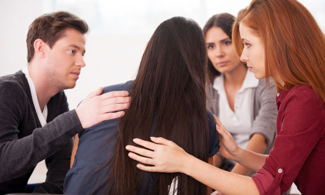 Supportive Group photo by g-stockstudio / Shutterstock.
