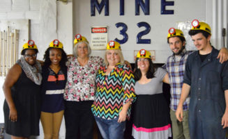 Appalachian Transition Fellows in mining helmets.