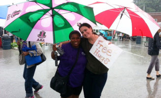 Volunteer giving a free hug at the Ferguson Farmers Market. Photo courtesy of Molly Rockamann.
