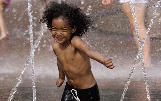 A child plays at the Christian Science Plaza in Boston