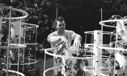 Joel McKinney with hydroponic towers