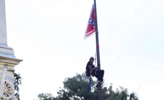 Bree Newsome climbs a flagpole in Columbia