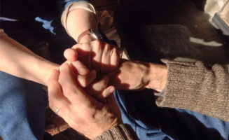 Clasped hands.