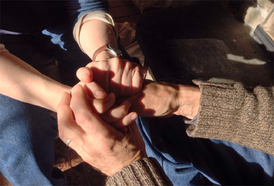 Clasped hands.