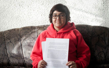 Noam Gur poses with her letter