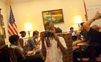 Young occupier plays with camera